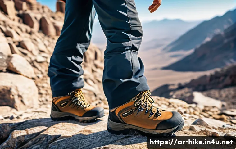 등산 필수 장비 리스트 - A rugged mountain climber standing on a rocky trail under a bright clear sky, wearing sturdy, thick-...